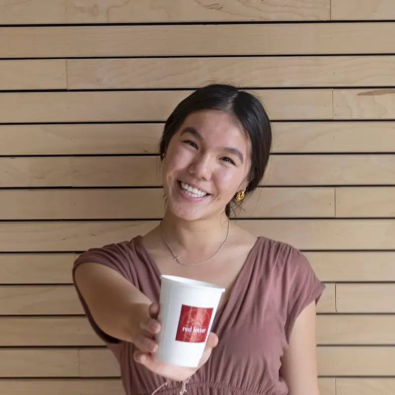 Catherine Norris holding Red Letter Coffee Co. branded cup