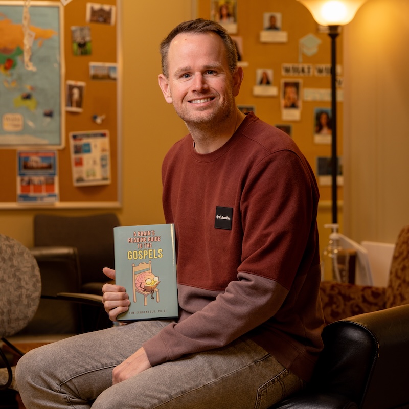Dr. Tim Schoenfeld with his new book, "A Brain's Reading Guide to the Gospels."