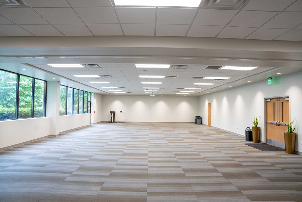 Gabhart A&B combined but mostly empty with plant and trash cans by the door.