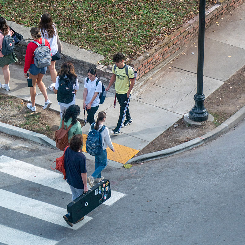 A view from above of students at a crosswalk