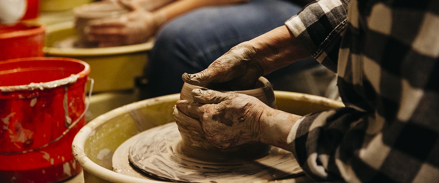 Students working in a pottery class